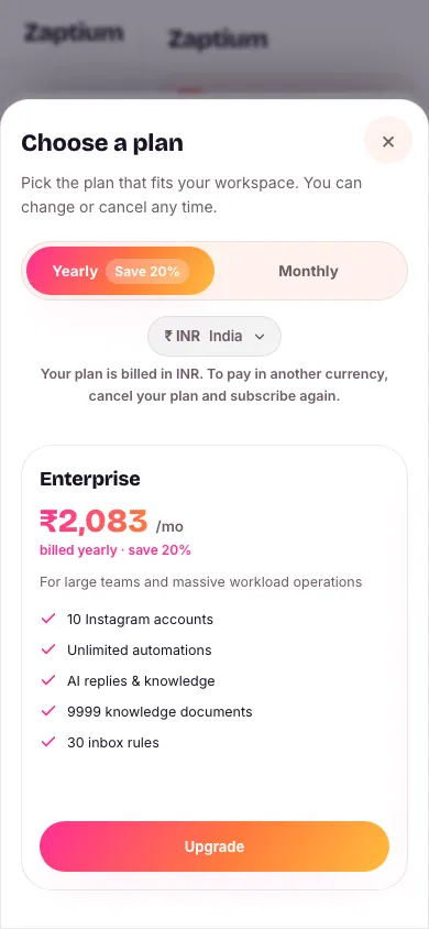The Choose a plan dialog showing two plans side by side with a monthly/yearly switch and a currency switch